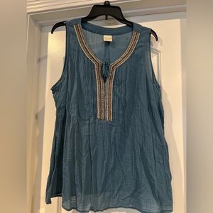 Sleeveless lightweight top with beading accent and tie neckline
